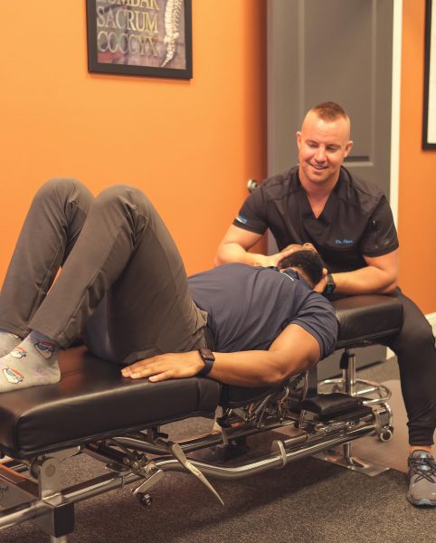dr ryan providing chiropractic neck treatment in sarasota